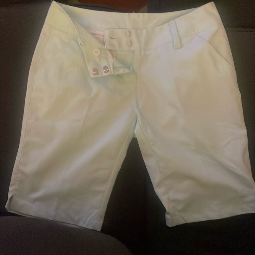 Adidas women's golf shorts size 0 runs a little big for a 0. 4 pockets